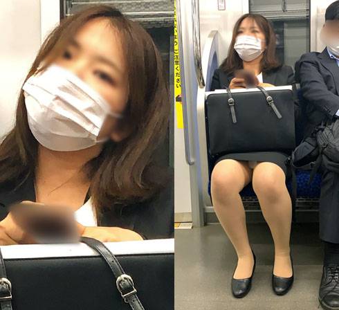 カメラに視線を向けて警戒するエッチな身体をしたスーツOLさん サンプル画像